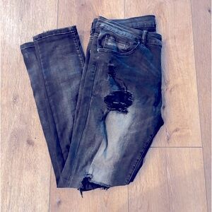 Black distressed jeans with ripped knees
